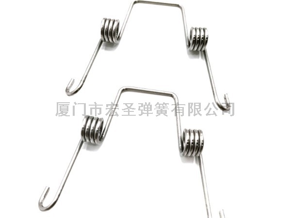 扭力弹簧在可伸缩花园水管中是如何使用的？